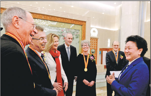 Vice-Premier Liu Yandong (right) interacts with winners of the International Science and Technology Cooperation Award and their families after an annual ceremony was held to honor distinguished scientists and research achievements in Beijing on Monday.Zhou Weihai / For China Daily Vice-Premier Liu Yandong (right) interacts with winners of the International Science and Technology Cooperation Award and their families after an annual ceremony was held to honor distinguished scientists and research achievements in Beijing on Monday.Zhou Weihai / For China Daily