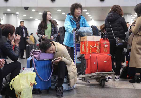 Passengers are stranded at Beijing Capital International Airport due to flight delays caused by heavy smog in December.Feng Yongbin / China Daily Passengers are stranded at Beijing Capital International Airport due to flight delays caused by heavy smog in December.Feng Yongbin / China Daily