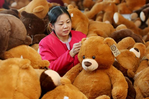 A worker inspects toys at Dongsheng Toy Company in Ganyu, Jiangsu province. The company is an exporter to the European and U.S. markets. (Photo by Si Wei/For China Daily) A worker inspects toys at Dongsheng Toy Company in Ganyu, Jiangsu province. The company is an exporter to the European and U.S. markets. (Photo by Si Wei/For China Daily)