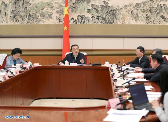 Chinese Premier Li Keqiang (back, C) presides over a symposium to solicit opinions from experts and entrepreneurs on the draft of an annual government work report in Beijing, capital of China, Jan. 13, 2017. (Xinhua/Ma Zhancheng)