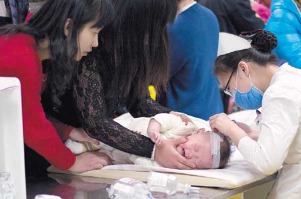 A child receives treatment at Beijing Children's Hospital in December. DING SHAN/CHINA DAILY A child receives treatment at Beijing Children's Hospital in December. DING SHAN/CHINA DAILY