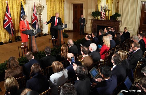 U.S. President Donald Trump and British Prime Minister Theresa May hold a joint press conference at the White House in Washington D.C., the United States, Jan. 27, 2017. U.S. President Donald Trump said Friday that it is very early to talk about lifting sanctions on Russia in relation to the Ukraine crisis. (Xinhua/Yin Bogu) U.S. President Donald Trump and British Prime Minister Theresa May hold a joint press conference at the White House in Washington D.C., the United States, Jan. 27, 2017. U.S. President Donald Trump said Friday that it is very early to talk about lifting sanctions on Russia in relation to the Ukraine crisis. (Xinhua/Yin Bogu)
