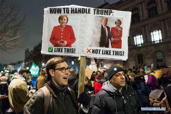 A demonstrator holds a placard as thousands gather outside Downing Street in London, Britain, to protest against U.S. President Donald Trump's executive order temporarily barring all refugees and seven Mideast and North African countries' citizens from entry into the United States, on Jan. 30, 2017. (Xinhua/Ray Tang) A demonstrator holds a placard as thousands gather outside Downing Street in London, Britain, to protest against U.S. President Donald Trump's executive order temporarily barring all refugees and seven Mideast and North African countries' citizens from entry into the United States, on Jan. 30, 2017. (Xinhua/Ray Tang)