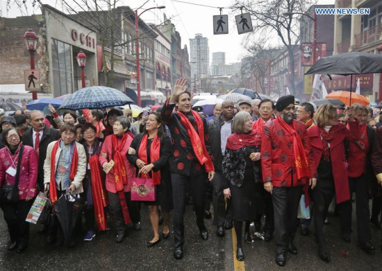 Canada's Prime Minister Justin Trudeau (C) participates in the Chinese Lunar New Year parade in Vancouver, Canada, Jan. 29, 2017. More than 70 parade troops with 3,000 participants paraded along the streets of Chinatown to celebrate the Year of the Rooster. (Xinhua/Liang Sen) Canada's Prime Minister Justin Trudeau (C) participates in the Chinese Lunar New Year parade in Vancouver, Canada, Jan. 29, 2017. More than 70 parade troops with 3,000 participants paraded along the streets of Chinatown to celebrate the Year of the Rooster. (Xinhua/Liang Sen)