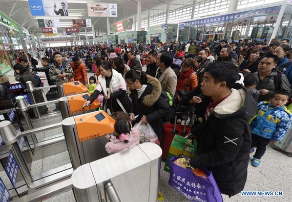 Passengers enter the Nanchang West Railway Station in Nanchang, capital of east China's Jiangxi Province, Feb. 1, 2017. After the Chinese Lunar New Year, the Nanchang West Railway Station witnessed a travel peak on Wednesday as people started to travel to other cities for school and work. (Xinhua/Peng Zhaozhi) Passengers enter the Nanchang West Railway Station in Nanchang, capital of east China's Jiangxi Province, Feb. 1, 2017. After the Chinese Lunar New Year, the Nanchang West Railway Station witnessed a travel peak on Wednesday as people started to travel to other cities for school and work. (Xinhua/Peng Zhaozhi)