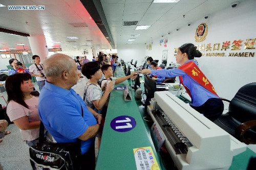 Taiwan residents register for the Mainland Travel Permit of Taiwan Residents (MTP) at the exit-entry administration hall of the Wutong dock in Xiamen, southeast China's Fujian Province, July 1, 2015. (File photo/Xinhua) Taiwan residents register for the Mainland Travel Permit of Taiwan Residents (MTP) at the exit-entry administration hall of the Wutong dock in Xiamen, southeast China's Fujian Province, July 1, 2015. (File photo/Xinhua)