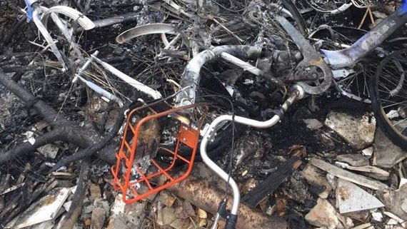 Public shared bikes are badly disfigured by torching . (Photo/CGTN) Public shared bikes are badly disfigured by torching . (Photo/CGTN)