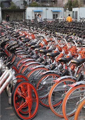 Bicycles, mostly from the bike-sharing company Mobike, were parked at a parking lot on Wednesday. (Photo/China Daily) Bicycles, mostly from the bike-sharing company Mobike, were parked at a parking lot on Wednesday. (Photo/China Daily)