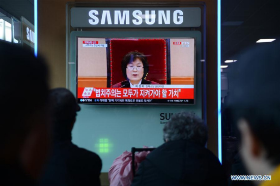 People watch a TV screen broadcasting news about Park Geun-hye's impeachment in Seoul, South Korea, March 10, 2017. South Korean President Park Geun-hye was permanently removed from office Friday as the constitutional court upheld the motion to impeach the scandal-hit leader. (Xinhua/Liu Yun) People watch a TV screen broadcasting news about Park Geun-hye's impeachment in Seoul, South Korea, March 10, 2017. South Korean President Park Geun-hye was permanently removed from office Friday as the constitutional court upheld the motion to impeach the scandal-hit leader. (Xinhua/Liu Yun)