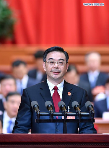 Chief Justice Zhou Qiang delivers a work report of the Supreme People's Court at the third plenary meeting of the fifth session of the 12th National People's Congress at the Great Hall of the People in Beijing, capital of China, March 12, 2017. (Xinhua/Li Tao) 