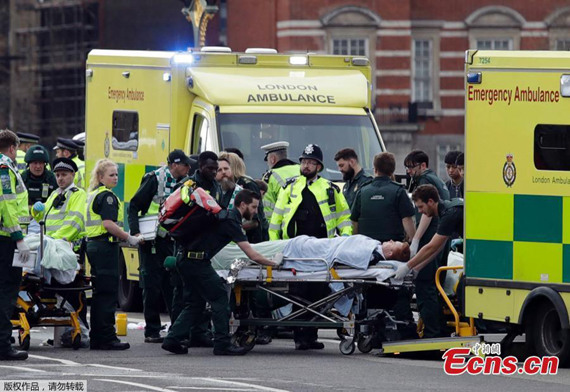 A man is treated by emergency services near Westminster Bridge and the Houses of Parliament on March 22, 2017 in London, England.Police cordon off the street outside the Houses of Parliament in London, Britain on March 22, 2017. Five people have been killed, including the stabbed officer and a male terrorist in an attack on the Houses of Parliament Wednesday afternoon in a terrorist attack, police announced.(Photo/Agencies) A man is treated by emergency services near Westminster Bridge and the Houses of Parliament on March 22, 2017 in London, England.Police cordon off the street outside the Houses of Parliament in London, Britain on March 22, 2017. Five people have been killed, including the stabbed officer and a male terrorist in an attack on the Houses of Parliament Wednesday afternoon in a terrorist attack, police announced.(Photo/Agencies)