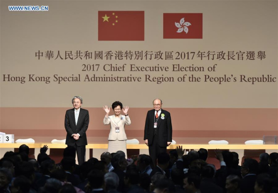 Lam Cheng Yuet-ngor (C) waves to people after winning the election at the Hong Kong Convention and Exhibition Center in Hong Kong, south China, March 26, 2017. (Xinhua/Wang Shen) Lam Cheng Yuet-ngor (C) waves to people after winning the election at the Hong Kong Convention and Exhibition Center in Hong Kong, south China, March 26, 2017. (Xinhua/Wang Shen)