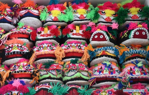 Photo taken on March 10, 2017 shows tiger-head shoes collection of Hu Shuqing in Zhengzhou City of central China's Henan Province. Photo taken on March 10, 2017 shows tiger-head shoes collection of Hu Shuqing in Zhengzhou City of central China's Henan Province.