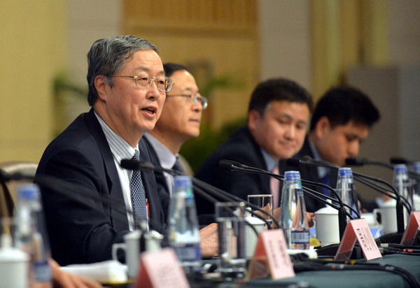 Zhou Xiaochuan, China's central bank governor, speaks at a news conference on China's currency policy and financial reform held by the first session of the 12th National People's Congress (NPC) in Beijing, March 13, 2013. (Photo/Xinhua) Zhou Xiaochuan, China's central bank governor, speaks at a news conference on China's currency policy and financial reform held by the first session of the 12th National People's Congress (NPC) in Beijing, March 13, 2013. (Photo/Xinhua)