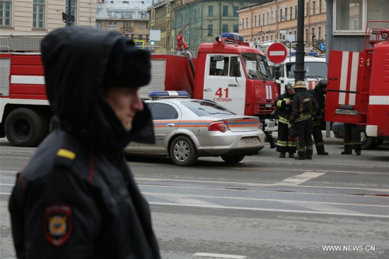 Policemen and firemen stand outside the metro station where a blast went off in St. Petersburg, Russia, on April 3, 2017. Policemen and firemen stand outside the metro station where a blast went off in St. Petersburg, Russia, on April 3, 2017.