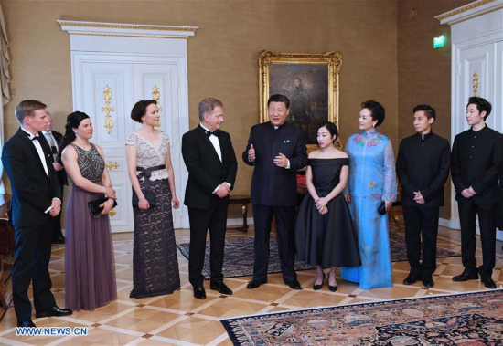 Chinese President Xi Jinping and his Finnish counterpart Sauli Niinisto meet skaters' representatives from the two countries in Helsinki, Finland, April 5, 2017. The athletes just attended the World Figure Skating Championships 2017, which ran from March 29 to April 2 in Helsinki, Finland. (Xinhua/Rao Aimin)