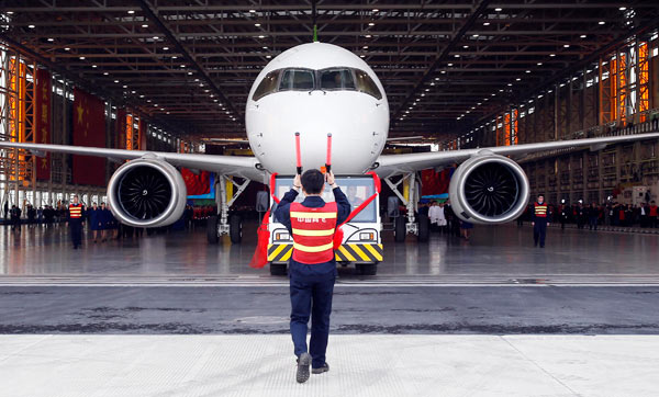 A C919 aircraft rolls off the assembly line in Shanghai. The plane, China's homegrown big passenger jet, completed its first high-speed taxiing test on Sunday. (Photo by Yin Liqin/For China Daily) A C919 aircraft rolls off the assembly line in Shanghai. The plane, China's homegrown big passenger jet, completed its first high-speed taxiing test on Sunday. (Photo by Yin Liqin/For China Daily)