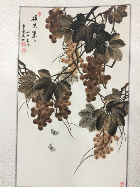 A feather painting made by Xu. (Photo by Tan Yingzi/China Daily) A feather painting made by Xu. (Photo by Tan Yingzi/China Daily)