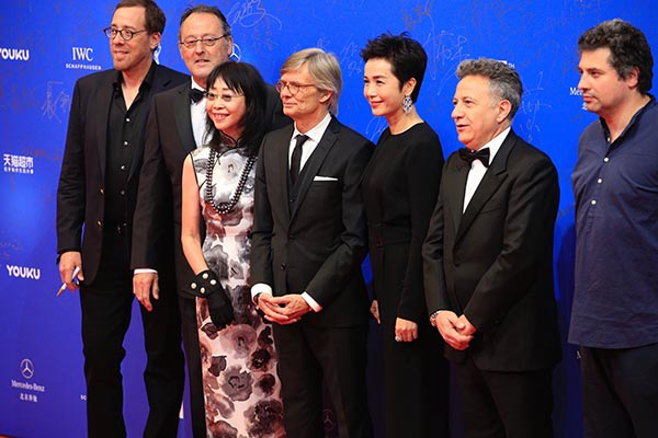 A seven-member international jury, including Danish cinematic master Bille August (center), Hong Kong director Mabel Cheung (third left) and actress Jiang Wenli, at the opening of the film festival. (Photo by Jiang Dong/China Daily) A seven-member international jury, including Danish cinematic master Bille August (center), Hong Kong director Mabel Cheung (third left) and actress Jiang Wenli, at the opening of the film festival. (Photo by Jiang Dong/China Daily)
