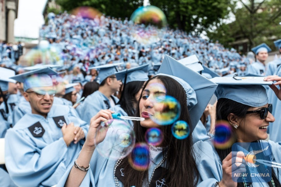 Members of the graduating class of 2016 blow bubbles during the Commencement ceremony of the 262nd Academic Year of Columbia University in New York, the United States on May 18, 2016. (Xinhua/Li Muzi) Members of the graduating class of 2016 blow bubbles during the Commencement ceremony of the 262nd Academic Year of Columbia University in New York, the United States on May 18, 2016. (Xinhua/Li Muzi)
