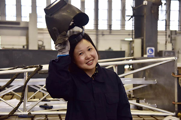 Huang Chunyan takes off her welding helmet at the workshop of Anhui Brainware Chang'an Electronics Co Ltd in Lu'an, Anhui province, April 25, 2017. (Photo by Song Wei/chinadaily.com.cn) Huang Chunyan takes off her welding helmet at the workshop of Anhui Brainware Chang'an Electronics Co Ltd in Lu'an, Anhui province, April 25, 2017. (Photo by Song Wei/chinadaily.com.cn)