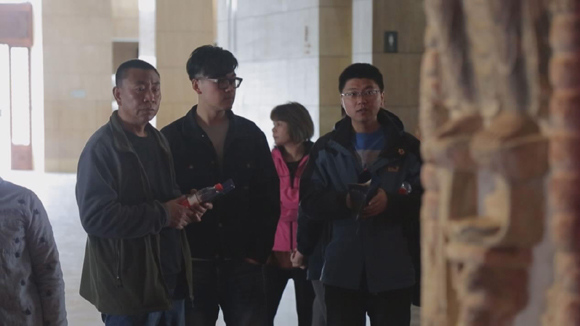Visitors came to see the ancient pagoda in the Shanxi Museum. (Photo/CGTN) Visitors came to see the ancient pagoda in the Shanxi Museum. (Photo/CGTN)