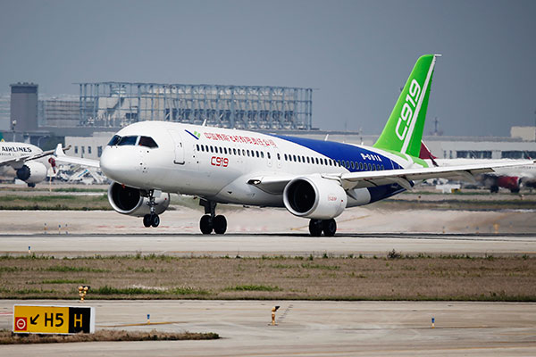 The C919, China's first domestically produced passenger jet, undergoes its fourth high-speed taxiing test in Shanghai on Sunday. YIN LIQIN/CHINA DAILY The C919, China's first domestically produced passenger jet, undergoes its fourth high-speed taxiing test in Shanghai on Sunday. YIN LIQIN/CHINA DAILY