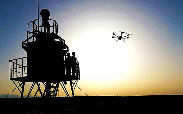 Border guards in the Xinjiang Uygur antonomous region direct a drone to patrol border areas in the region recently.ZHAO YONGFENG/CHINA DAILY Border guards in the Xinjiang Uygur antonomous region direct a drone to patrol border areas in the region recently.ZHAO YONGFENG/CHINA DAILY