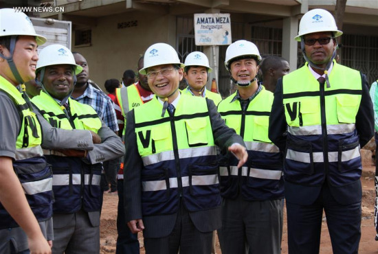 Chinese Ambassador to Rwanda Rao Hongwei (C, Front), Mayor of Kigali Nyamulinda Pascal (2nd L) and other Rwandan officials visit an urban road upgrading project carried out by a Chinese company in Kigali, capital of Rwanda, on May 2, 2017. (Xinhua/Lyu Tianran) Chinese Ambassador to Rwanda Rao Hongwei (C, Front), Mayor of Kigali Nyamulinda Pascal (2nd L) and other Rwandan officials visit an urban road upgrading project carried out by a Chinese company in Kigali, capital of Rwanda, on May 2, 2017. (Xinhua/Lyu Tianran)