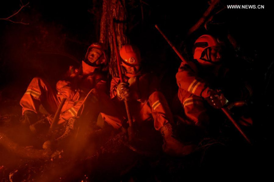 Firefighters take a rest at Bilahe Beidahe forest in the Greater Hinggan Mountains, in north China's Inner Mongolia Autonomous Region, May 4, 2017. (Xinhua/Lian Zhen) Firefighters take a rest at Bilahe Beidahe forest in the Greater Hinggan Mountains, in north China's Inner Mongolia Autonomous Region, May 4, 2017. (Xinhua/Lian Zhen)