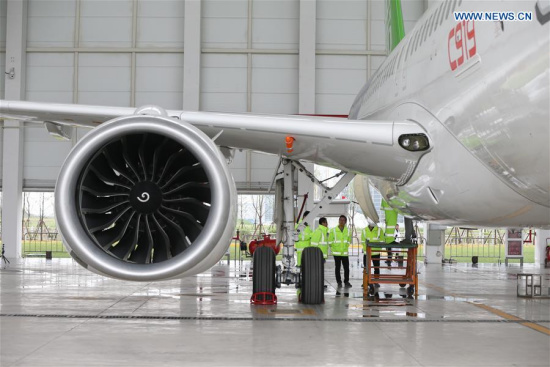 Staff workers check a C919, China's first domestically-built large passenger jet, at a hangar of the Commercial Aircraft Corporation of China (COMAC) in Shanghai, east China, May 4, 2017. (Xinhua/Ding Ting) Staff workers check a C919, China's first domestically-built large passenger jet, at a hangar of the Commercial Aircraft Corporation of China (COMAC) in Shanghai, east China, May 4, 2017. (Xinhua/Ding Ting)