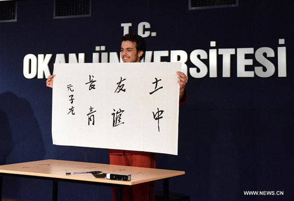 Ibrahim Zubeyir Agar displays his calligraphy at the 16th Chinese proficiency competition for Turkish college students in Istanbul, Turkey, on May 6, 2017. The 16th Chinese proficiency competition for college students in Turkey was held here on Saturday, with top ten winners offered a chance to visit China. (Xinhua/He Canling) Ibrahim Zubeyir Agar displays his calligraphy at the 16th Chinese proficiency competition for Turkish college students in Istanbul, Turkey, on May 6, 2017. The 16th Chinese proficiency competition for college students in Turkey was held here on Saturday, with top ten winners offered a chance to visit China. (Xinhua/He Canling)