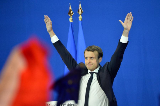 File photo taken on April 23, 2017 shows Emmanuel Macron, French presidential candidate for the On the Move (En Marche) movement, greeting his supporters at a rally after the first round of French presidential election in Paris, France. Macron, with 65.9 percent of vote, beats Le Pen in French runoff Presidential vote on Sunday, according to polling agency projections. (Xinhua/Jose Rodriguez) File photo taken on April 23, 2017 shows Emmanuel Macron, French presidential candidate for the On the Move (En Marche) movement, greeting his supporters at a rally after the first round of French presidential election in Paris, France. Macron, with 65.9 percent of vote, beats Le Pen in French runoff Presidential vote on Sunday, according to polling agency projections. (Xinhua/Jose Rodriguez)
