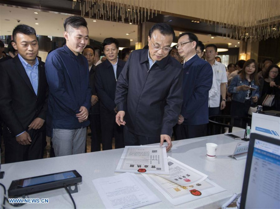 Chinese Premier Li Keqiang (front R) visits the Kaifeng comprehensive service center of China (Henan) Pilot Free Trade Zone in Kaifeng, central China's Henan Province, May 8, 2017. Li made an inspection tour to central China's Henan Province on May 8 and 9. (Xinhua/Li Tao) Chinese Premier Li Keqiang (front R) visits the Kaifeng comprehensive service center of China (Henan) Pilot Free Trade Zone in Kaifeng, central China's Henan Province, May 8, 2017. Li made an inspection tour to central China's Henan Province on May 8 and 9. (Xinhua/Li Tao)