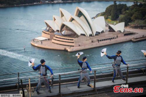 The Sydney Opera House appears above the Sydney Harbour Bridge, May 2, 2017, as the first tai chi class is conducted in Australia's largest city by the Australian Academy of Tai Chi and Qigong. (Photo/Agencies) The Sydney Opera House appears above the Sydney Harbour Bridge, May 2, 2017, as the first tai chi class is conducted in Australia's largest city by the Australian Academy of Tai Chi and Qigong. (Photo/Agencies)