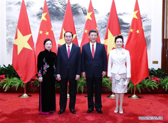 Chinese President Xi Jinping (2nd R) and his wife Peng Liyuan (1st R) pose for a photo with Vietnamese President Tran Dai Quang (2nd L) and his wife in Beijing, capital of China, May 11, 2017. Xi held a welcome ceremony for Vietnamese President Tran Dai Quang before their talks here on Thursday. (Xinhua/Ju Peng) Chinese President Xi Jinping (2nd R) and his wife Peng Liyuan (1st R) pose for a photo with Vietnamese President Tran Dai Quang (2nd L) and his wife in Beijing, capital of China, May 11, 2017. Xi held a welcome ceremony for Vietnamese President Tran Dai Quang before their talks here on Thursday. (Xinhua/Ju Peng)