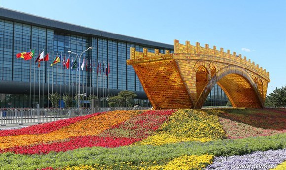 Photo taken on May 13, 2017 shows the Golden Bridge on Silk Road structure outside the National Convention Center in Beijing, capital of China. The Belt and Road Forum for International Cooperation will be held here from May 14 to 15. (Xinhua/Li He) Photo taken on May 13, 2017 shows the Golden Bridge on Silk Road structure outside the National Convention Center in Beijing, capital of China. The Belt and Road Forum for International Cooperation will be held here from May 14 to 15. (Xinhua/Li He)
