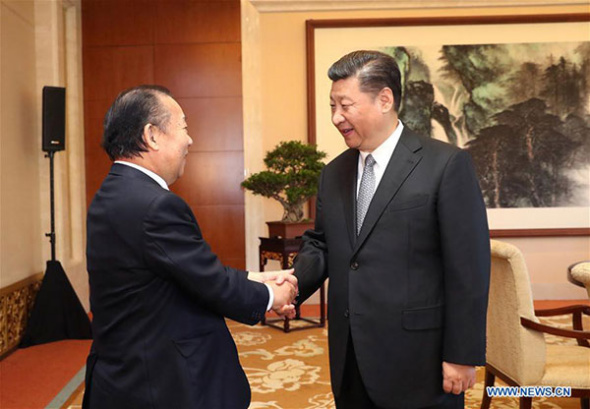 Chinese President Xi Jinping (R) meets with Toshihiro Nikai, secretary-general of Japan's ruling Liberal Democratic Party, in Beijing, capital of China, May 16, 2017. (Photo/Xinhua)