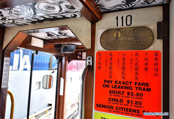 A new sign showing the ticket prices is seen in a newly-decorated tram in Hong Kong, south China, May 26, 2017. The HK Tramways revealed its new logo on Friday. Trams, known as ding-dings for the sound of their bells, have serviced the city's main island for more than a century. (Xinhua/Wang Xi) A new sign showing the ticket prices is seen in a newly-decorated tram in Hong Kong, south China, May 26, 2017. The HK Tramways revealed its new logo on Friday. Trams, known as ding-dings for the sound of their bells, have serviced the city's main island for more than a century. (Xinhua/Wang Xi)