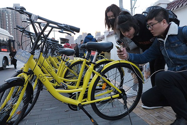 Riders scan ofo bikes in Xi'an, Shaanxi province. (Photo/China Daily) Riders scan ofo bikes in Xi'an, Shaanxi province. (Photo/China Daily)