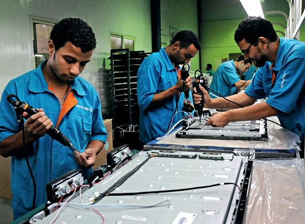 Egyptian Hisense Group workers assemble TV sets in the Suez Bay Northwest Economic Zone on September 21, 2011. Egyptian Hisense Group workers assemble TV sets in the Suez Bay Northwest Economic Zone on September 21, 2011.