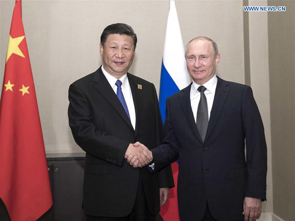 Chinese President Xi Jinping (L) meets with Russian President Vladimir Putin in Astana, Kazakhstan, June 8, 2017. (Xinhua/Lan Hongguang) Chinese President Xi Jinping (L) meets with Russian President Vladimir Putin in Astana, Kazakhstan, June 8, 2017. (Xinhua/Lan Hongguang)