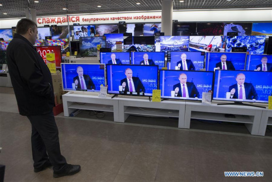 A customer watches TV as Russian President Vladimir Putin speaks during a televised event at a shop in Moscow, Russia, on June 15, 2017. (Xinhua/Oleg Brusnikin) A customer watches TV as Russian President Vladimir Putin speaks during a televised event at a shop in Moscow, Russia, on June 15, 2017. (Xinhua/Oleg Brusnikin)