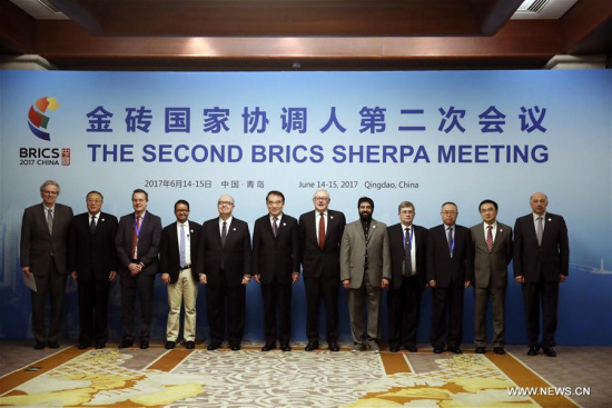 Participants of the second BRICS Sherpa meeting pose for a group photo in Qingdao, east China's Shandong Province, June 15, 2017. (Xinhua) Participants of the second BRICS Sherpa meeting pose for a group photo in Qingdao, east China's Shandong Province, June 15, 2017. (Xinhua)