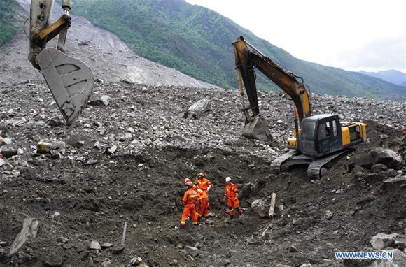 Rescuers search for survivors after a landslide in Xinmo Village of Maoxian County, Tibetan and Qiang Autonomous Prefecture of Aba, southwest China's Sichuan Province, June 25, 2017. Fifteen people had been taken off the list of missing people after the landslide in Sichuan early Saturday, leaving 93 still missing. (Xinhua/Jiang Hongjing) Rescuers search for survivors after a landslide in Xinmo Village of Maoxian County, Tibetan and Qiang Autonomous Prefecture of Aba, southwest China's Sichuan Province, June 25, 2017. Fifteen people had been taken off the list of missing people after the landslide in Sichuan early Saturday, leaving 93 still missing. (Xinhua/Jiang Hongjing)