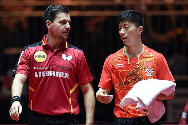 File photo shows China's Ma Long (R) and Germany's Timo Boll react before the men's doubles round of 64 match against Tamas Lakatos and Krisztian Nagy of Hungary at the 2017 World Table Tennis Championships in Dusseldorf, Germany, on May 30, 2017. Ma Long and Timo Boll won 4-0. (Photo/Xinhua) File photo shows China's Ma Long (R) and Germany's Timo Boll react before the men's doubles round of 64 match against Tamas Lakatos and Krisztian Nagy of Hungary at the 2017 World Table Tennis Championships in Dusseldorf, Germany, on May 30, 2017. Ma Long and Timo Boll won 4-0. (Photo/Xinhua)