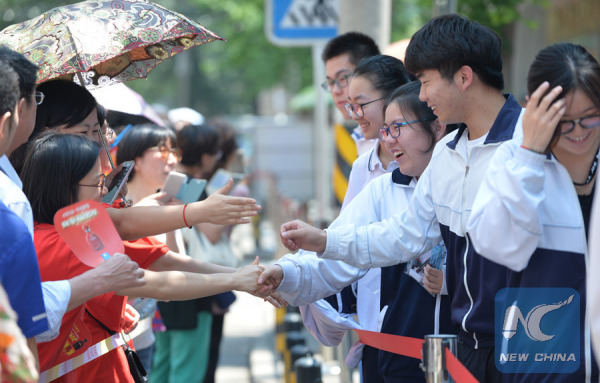 Students shake hands with their teachers after finishing their first subject of the examination in Beijing on June 7, 2017. (Xinhua/Wang Huajuan) Students shake hands with their teachers after finishing their first subject of the examination in Beijing on June 7, 2017. (Xinhua/Wang Huajuan)