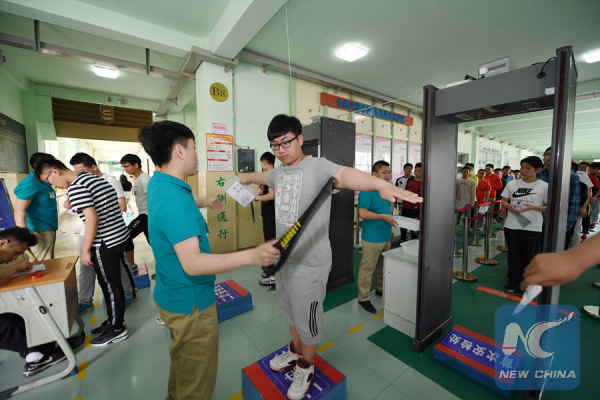 Students go through security and anti-cheating check before taking the exam in Jilin Province on June 7, 2017. (Xinhua/Meng Delong) Students go through security and anti-cheating check before taking the exam in Jilin Province on June 7, 2017. (Xinhua/Meng Delong)