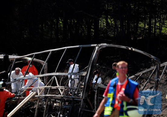Rescuers work in the site of the bus-truck collision accident in Bavaria, Germany, on July 3, 2017.German police confirmed on Monday on the Twitter account that many people are dead in a tour bus-truck collision accident in southern Germany. (Xinhua/Luo Huanhuan) Rescuers work in the site of the bus-truck collision accident in Bavaria, Germany, on July 3, 2017.German police confirmed on Monday on the Twitter account that many people are dead in a tour bus-truck collision accident in southern Germany. (Xinhua/Luo Huanhuan)
