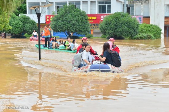 Rescuers help relocate students at flooded Guilin Tourism College in Guilin City, south China's Guangxi Zhuang Autonomous Region, July 3, 2017. Heavy rain and floods have left 16 people dead and 94,000 residents relocated in Guangxi. (Xinhua/Li Xuanli) Rescuers help relocate students at flooded Guilin Tourism College in Guilin City, south China's Guangxi Zhuang Autonomous Region, July 3, 2017. Heavy rain and floods have left 16 people dead and 94,000 residents relocated in Guangxi. (Xinhua/Li Xuanli)